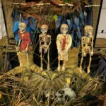 Four skeleton marionettes hang in wait